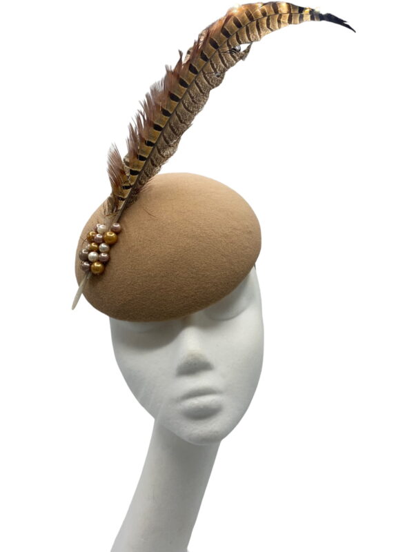 Tan felt headpiece with 2 large brown feathers with some coloured pearl detail to the base of feathers.